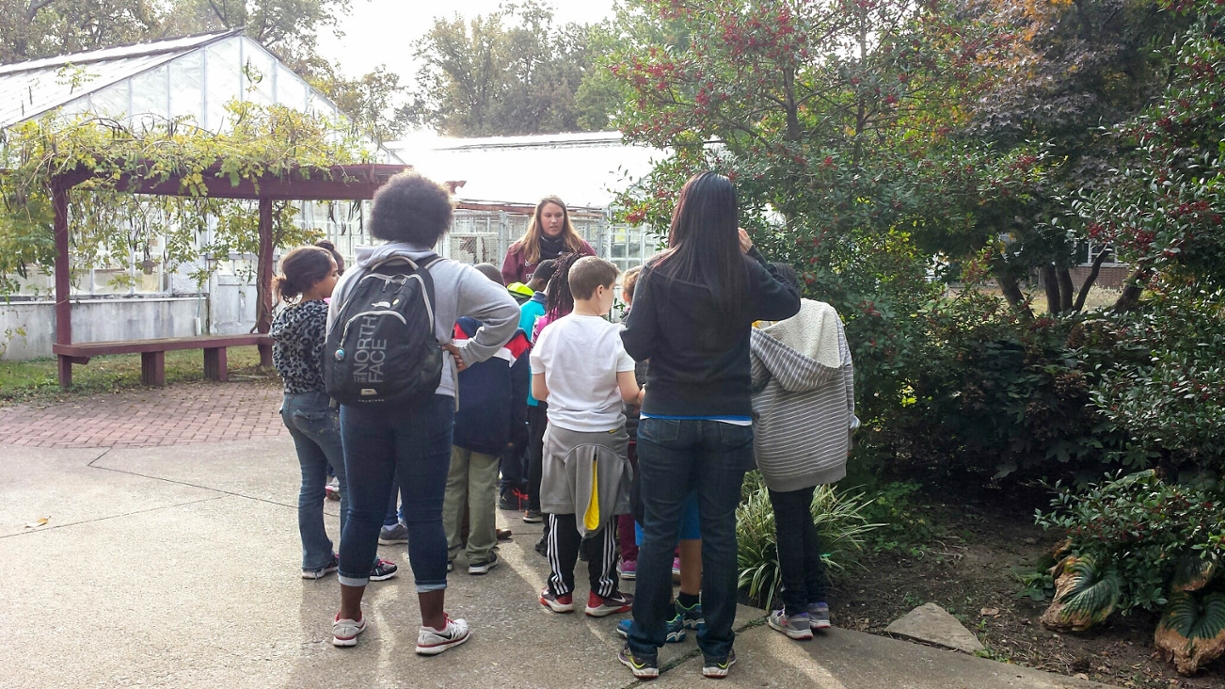 fourth graders listening to a tree walk speaker