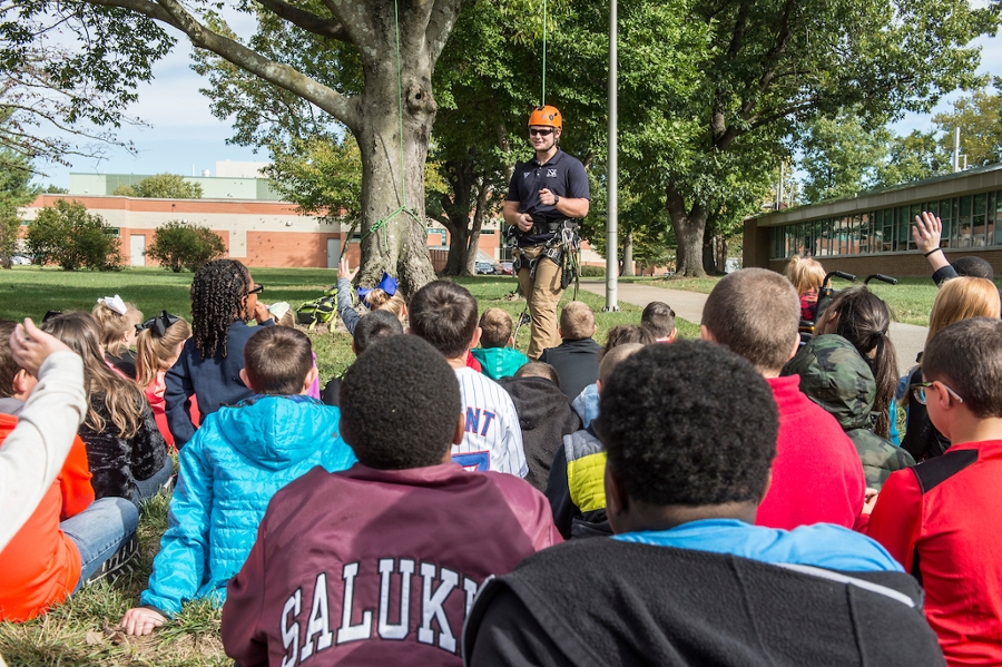 fourth graders sitting down watching a demonstration