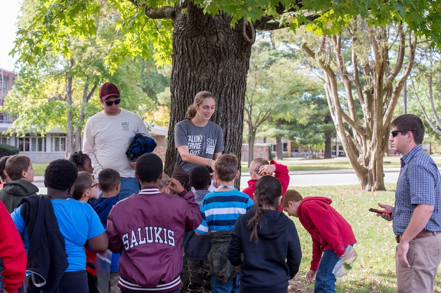 fourth graders listening to a speaker