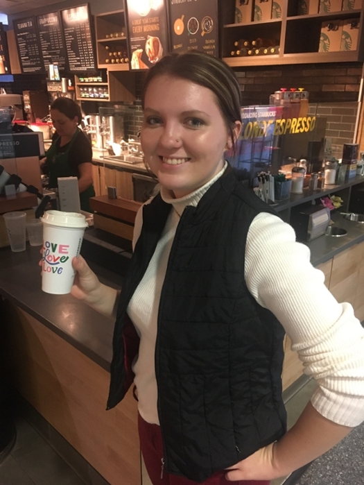 Samantha, one of our Sustainability Fellows, enjoys her coffee using her reusable coffee cup!