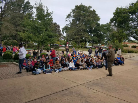 tree walk 4th graders sitting in a group