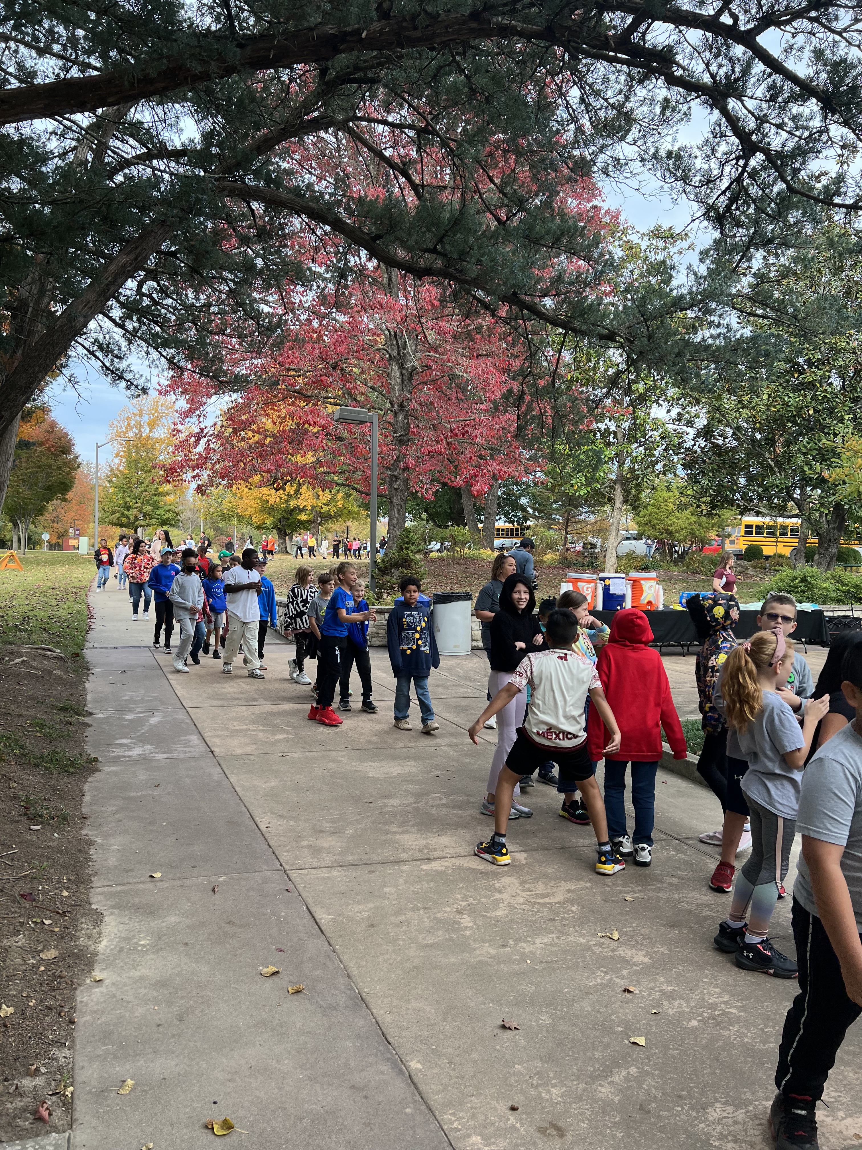 group of kids walking at tree planting event